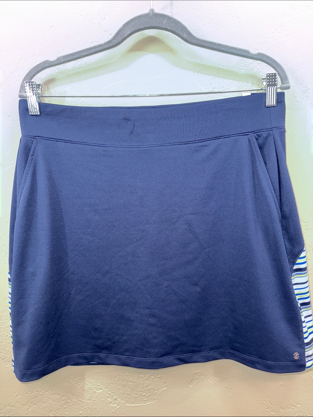 IZOD Golf Navy Skort with Stripe Accents. Side pockets. Undershorts. Size Medium